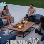 A group of people sitting on Tumbons modular outdoor lounge furniture at sunset on a luxury patio.